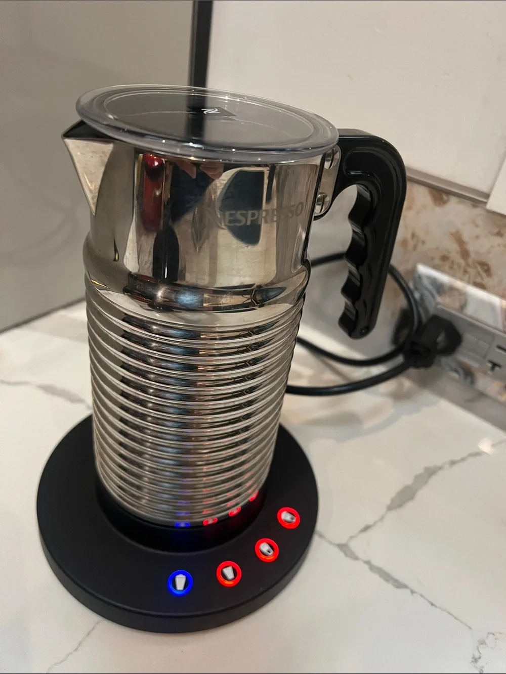 Nespresso Aeroccino 4 Milk Frother, a stainless steel electric milk frother